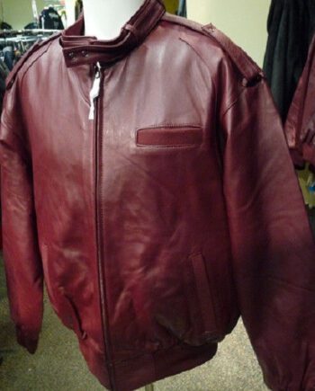a black leather jacket with a snap collar, a zippered front, and two side pockets.