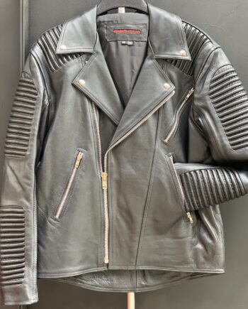 A close-up of a black leather jacket with ribbed details on the shoulders, sleeves, and back.