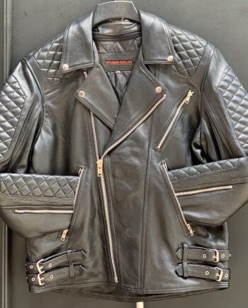 A man wearing a plain black biker diamond cowhide leather jacket with a zipper and pockets