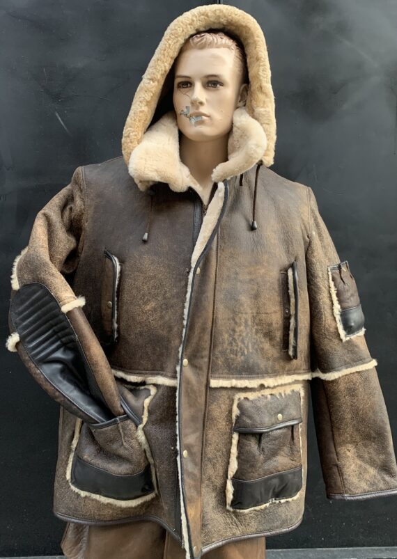 A brown shearling distressed parker with a zippered front, a hood, and four pockets