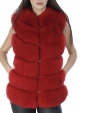 A woman wearing a red fox fur vest with a hook and eye closure and pockets.
