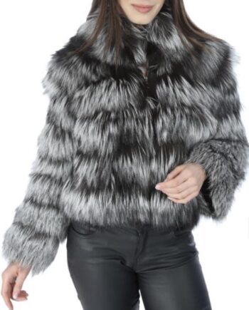 A woman wearing a brown fox fur jacket with a zipper and pockets.
