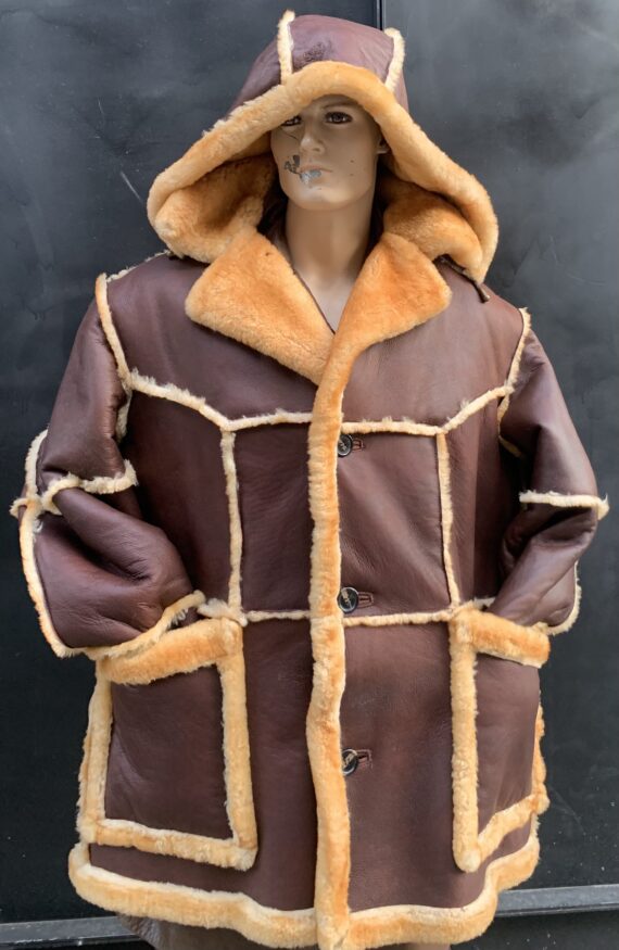 A brown marble shearling parker with a zippered front, a hood, and two pockets