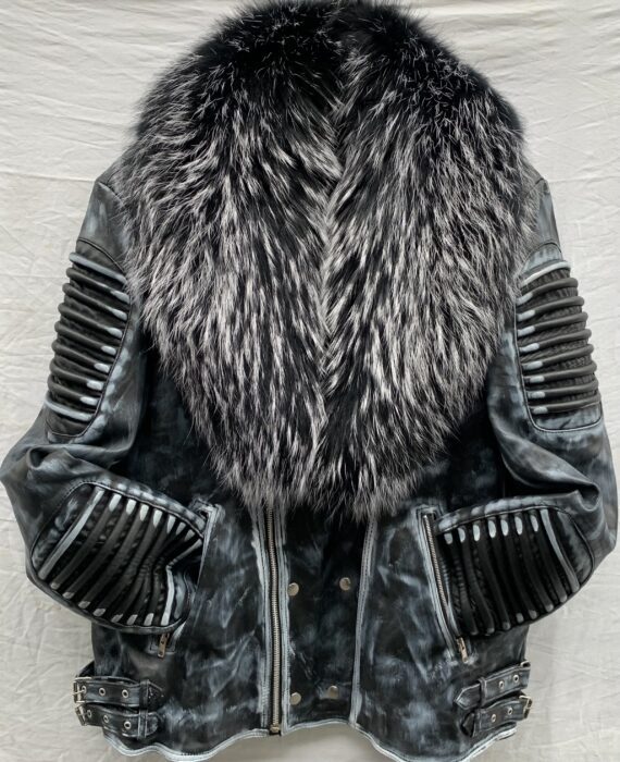 A waxed leather jacket with a natural fur collar, a zip front, and shoulder pads. The jacket is black and has a shiny finish.