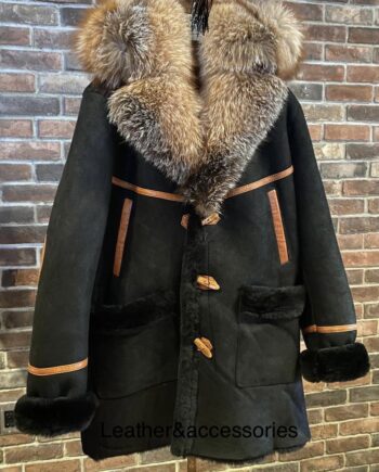 a 3/4 length coat made of shearling sheepskin and crystal fox fur, with a detachable hood, button closure, and side pockets. The coat is black and has a smooth and shiny surface.