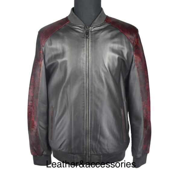 A leather baseball jacket made of pony skin leather, with a zip front, ribbed collar, cuffs, and hem, and side pockets. The jacket is black and has a natural hair-on pattern that contrasts with the smooth and shiny leather.