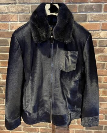 leather jacket made of pony skin and mink fur, with a detachable collar. The pony skin has a natural black and white pattern, while the mink fur is light brown and fluffy