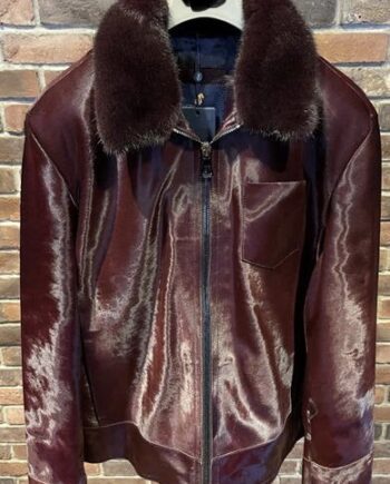 leather Jacket made of pony skin and mink fur, with a removable collar. The pony skin has a natural brown and white pattern, while the mink fur is dark brown and fluffy.